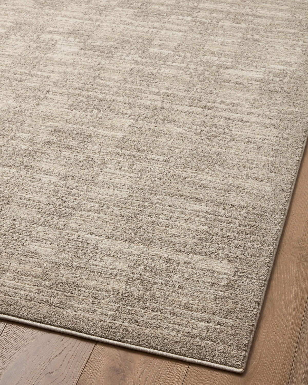 Loloi Darby neutral rug complements modern decor and lighting.