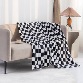 LOMAO cozy couch scene with blanket ready for movie night.