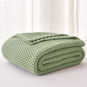 Longhui Bedding chunky knit blanket in a baby nursery for gentle warmth