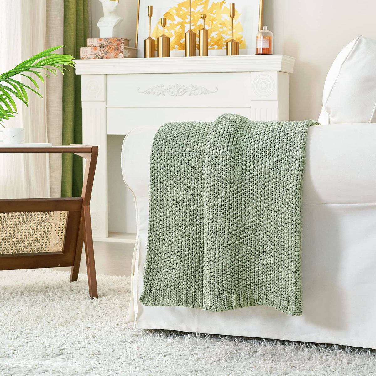 Longhui Bedding chunky knit blanket draped over sofa for cozy living room style