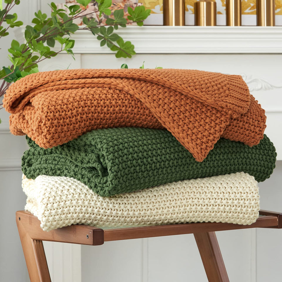 Longhui Bedding chunky knit throw beige front view on a bed for cozy style
