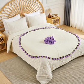 Longhui Lily of the Valley blanket on sofa enhances couch décor with floral charm.