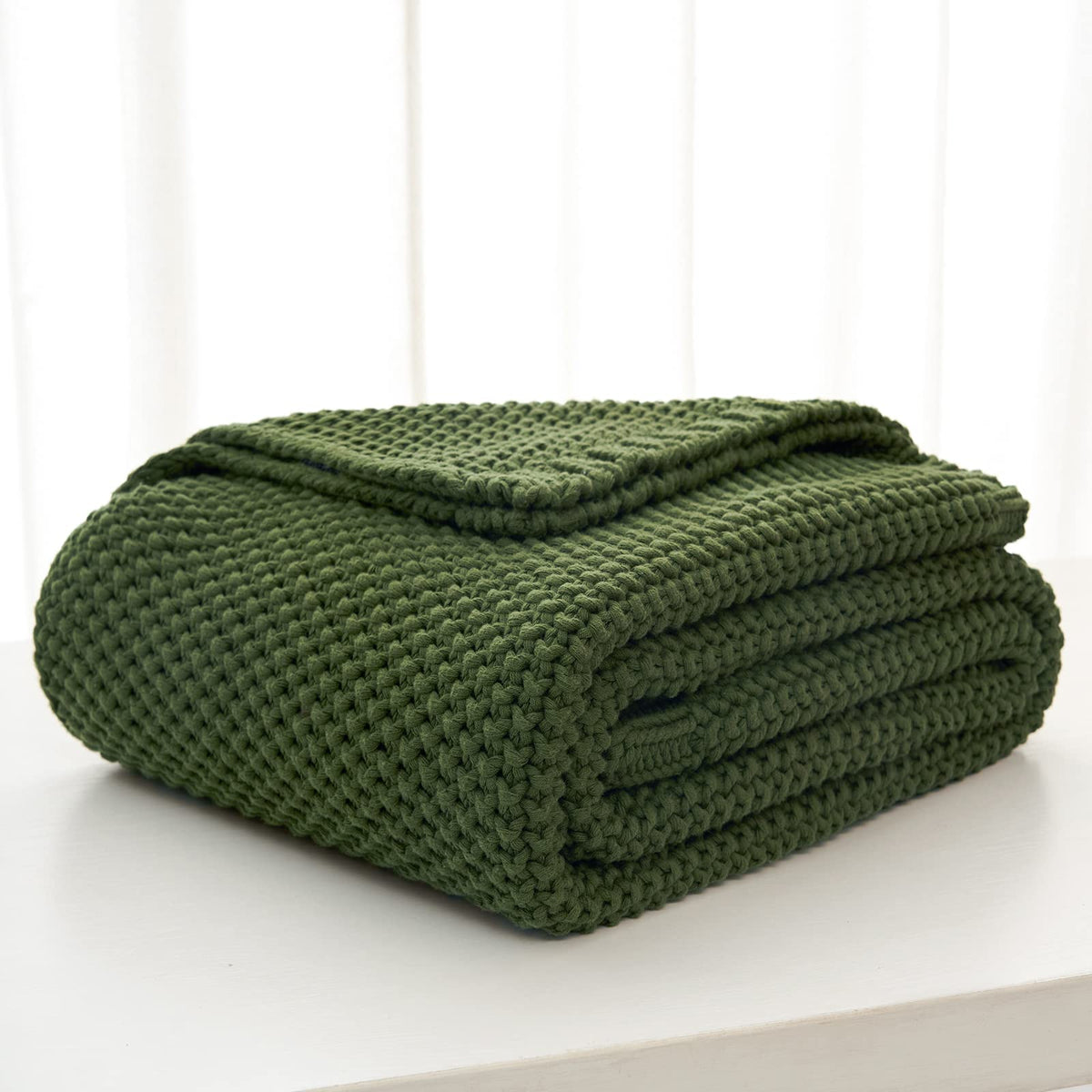 Longhui Bedding sofa decor scene shows versatile use as a decorative and warm layer.