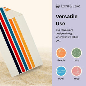 Loon & Lake retro stripes towel rolled for compact travel and storage.