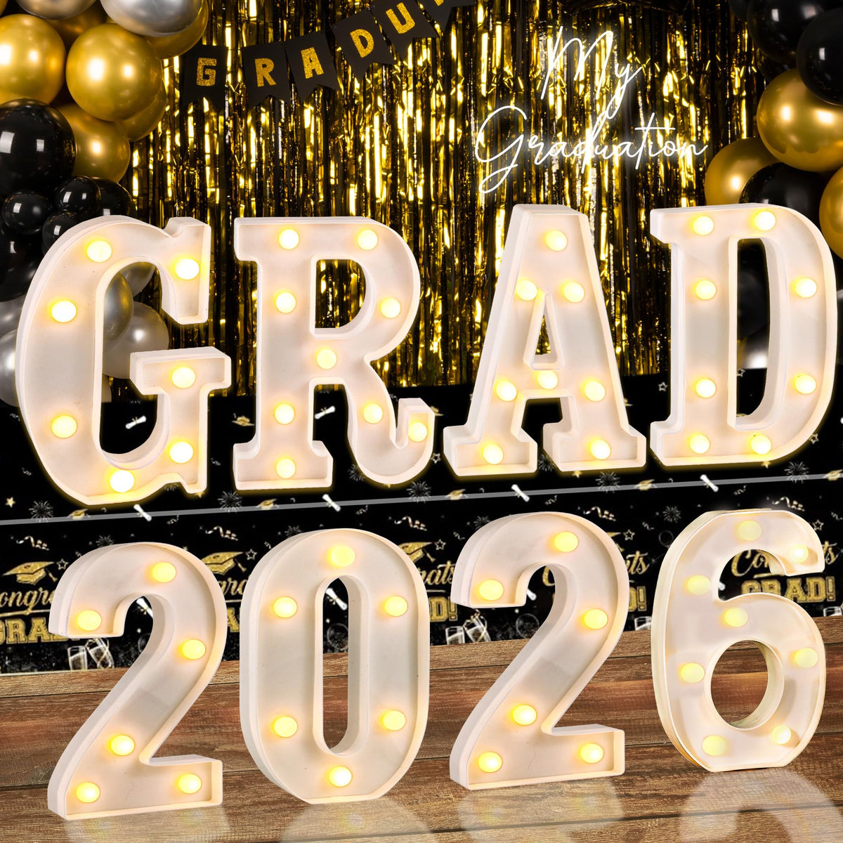 Lotus Hills Grad 2026 letters glow in closeup for photos