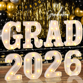 Lotus Hills Grad 2026 letters glow in closeup for photos