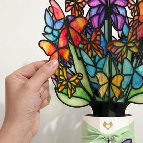 Lovepop stained-glass inspired butterfly wings casting colorful shadows in a sunny room