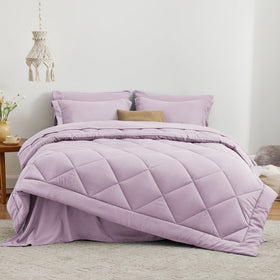 Love's cabin bed-in-a-bag seven-piece set ready for easy styling on full beds.