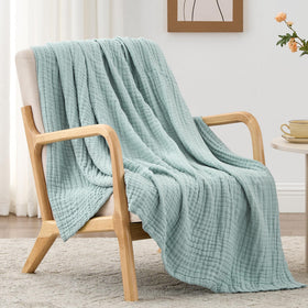 Love's cabin 6 layer muslin blanket with breathable gauze texture for cooler nights.