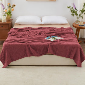 Love's cabin bed spread draped on a cozy bedroom for all-seasons comfort.