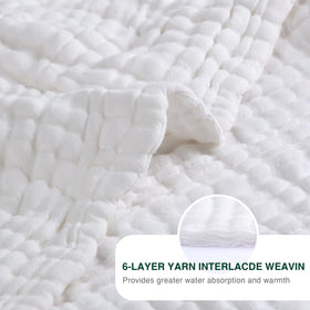 Love's Cabin blanket used for travel, draped over luggage for cozy on-the-go warmth.