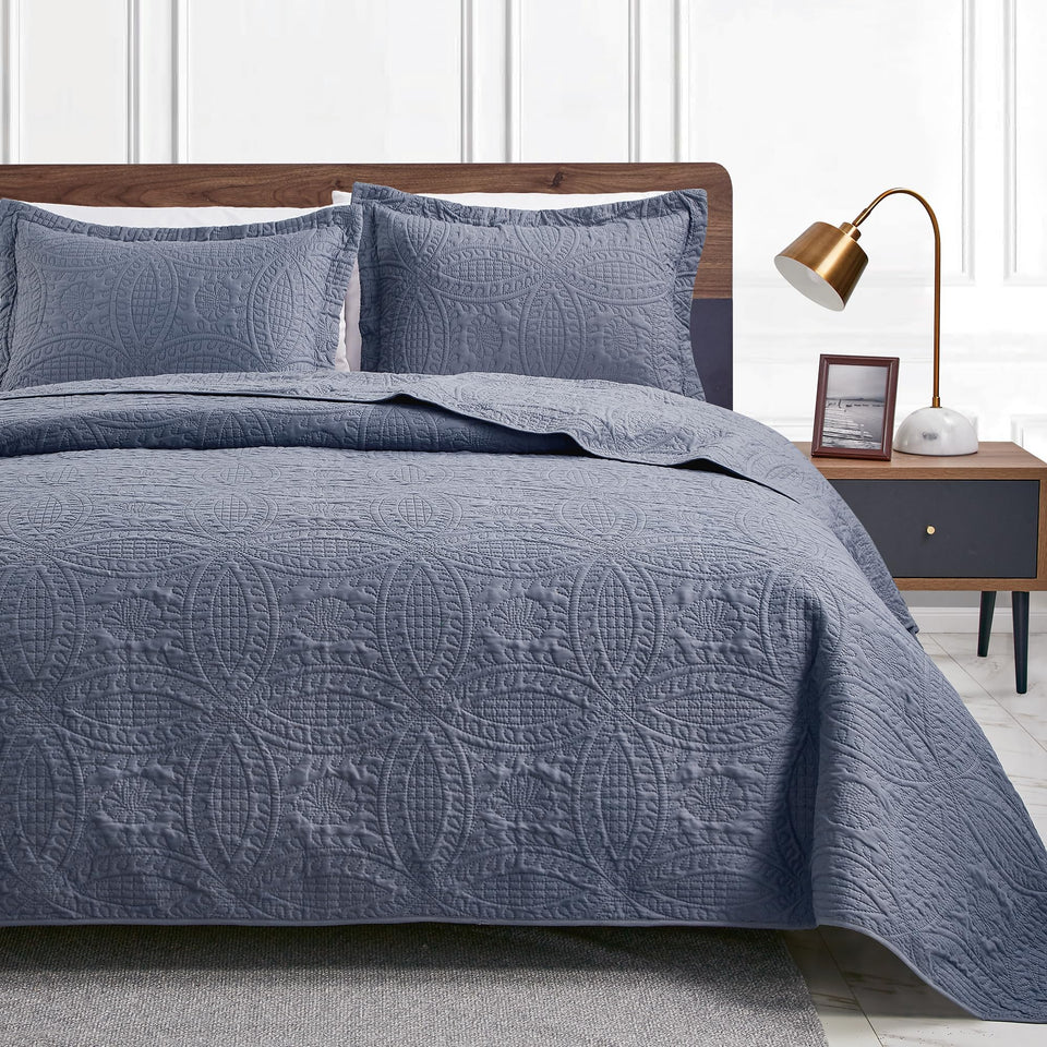 Love's cabin California King quilt set with blue coin pattern for a stylish, easy-care bed.