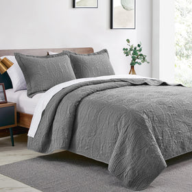 Love's cabin coin-pattern coverlet grey closeup highlights embossed texture and light feel.
