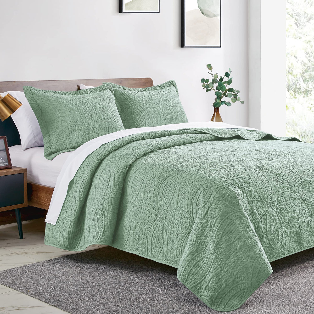 Love's cabin coin-pattern coverlet in sage enhances modern bedding aesthetic