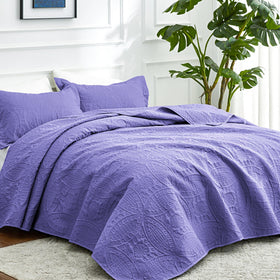 Love's cabin Coin Pattern Coverlet shown for versatile all-season layering.
