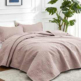 Love's cabin burlwood coverlet shown with ultrasonic pressing for durability.
