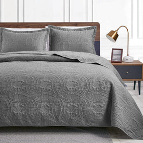 Love's cabin king quilt grey on bed offers year-round comfort.
