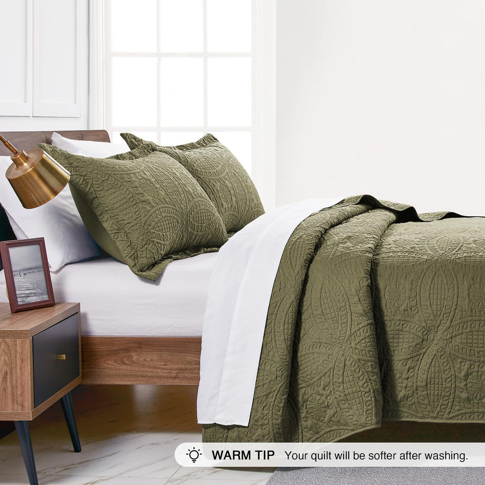 Love's cabin king quilt set with two shams enhances bed decor.