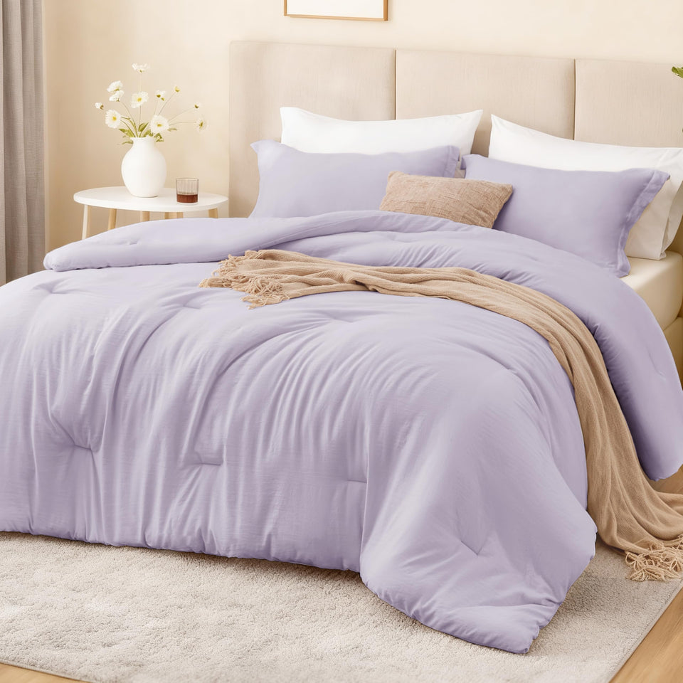 Love's cabin lavender twinxl comforter set on bed for a soft, cohesive look.
