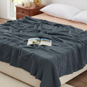 Love's cabin muslin blanket closeup shows 6-layer gauze for breathable comfort.