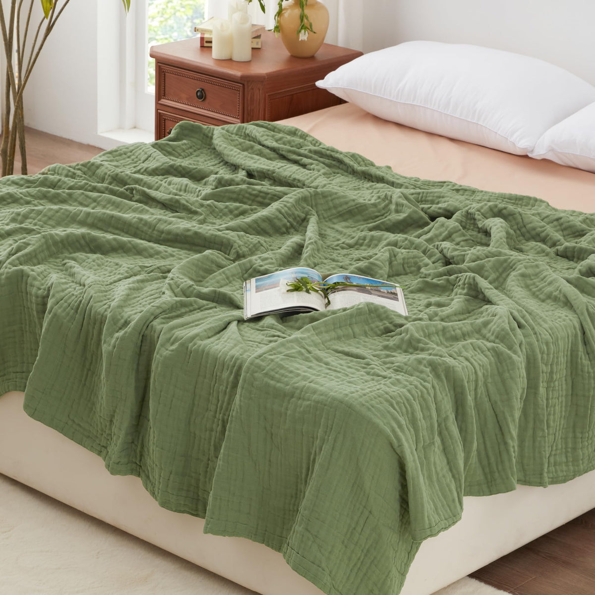 Love's cabin muslin blanket six-layer sage-green design offers year-round breathable comfort.