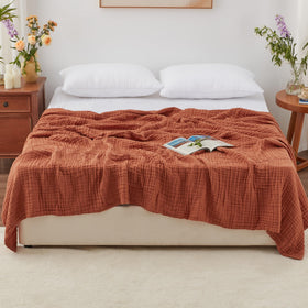 Love's cabin muslin blanket closeup weave—airy texture and softness.