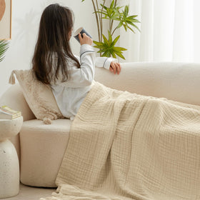 Travel-ready Love's cabin muslin blanket folded, compact and lightweight