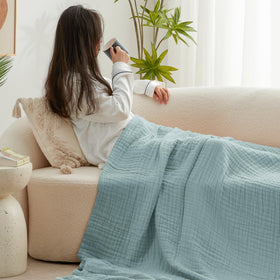 Love's cabin travel-friendly muslin blanket folded for packing