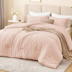 Love's cabin pink twin-xl comforter on bed, soft texture for cozy nights.