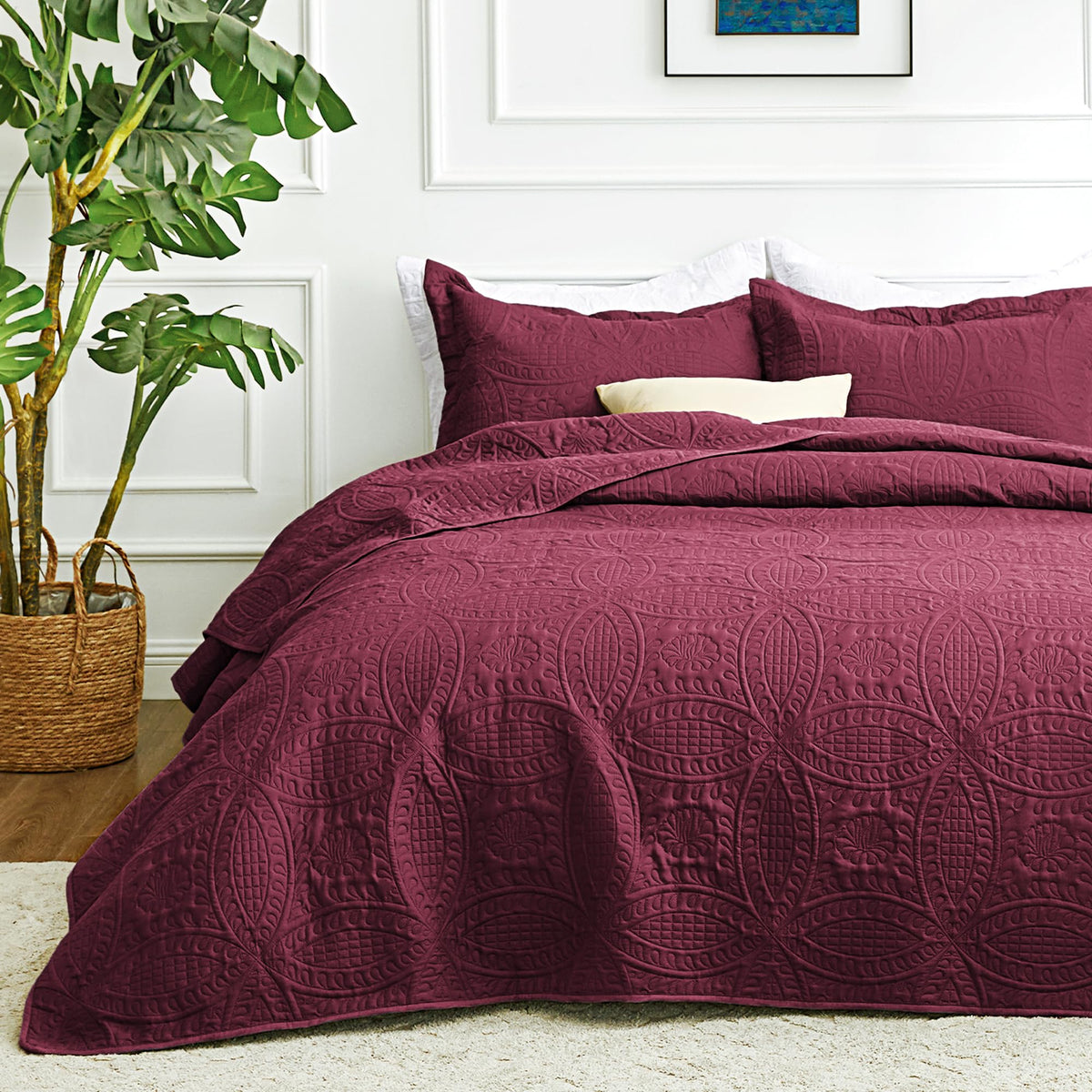Love's cabin queen burgundy quilt close-up shows rich color and quilted texture for year-round use.