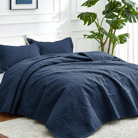 Love's cabin 3-piece quilt set in navy with two shams for coordinated bedroom decor.