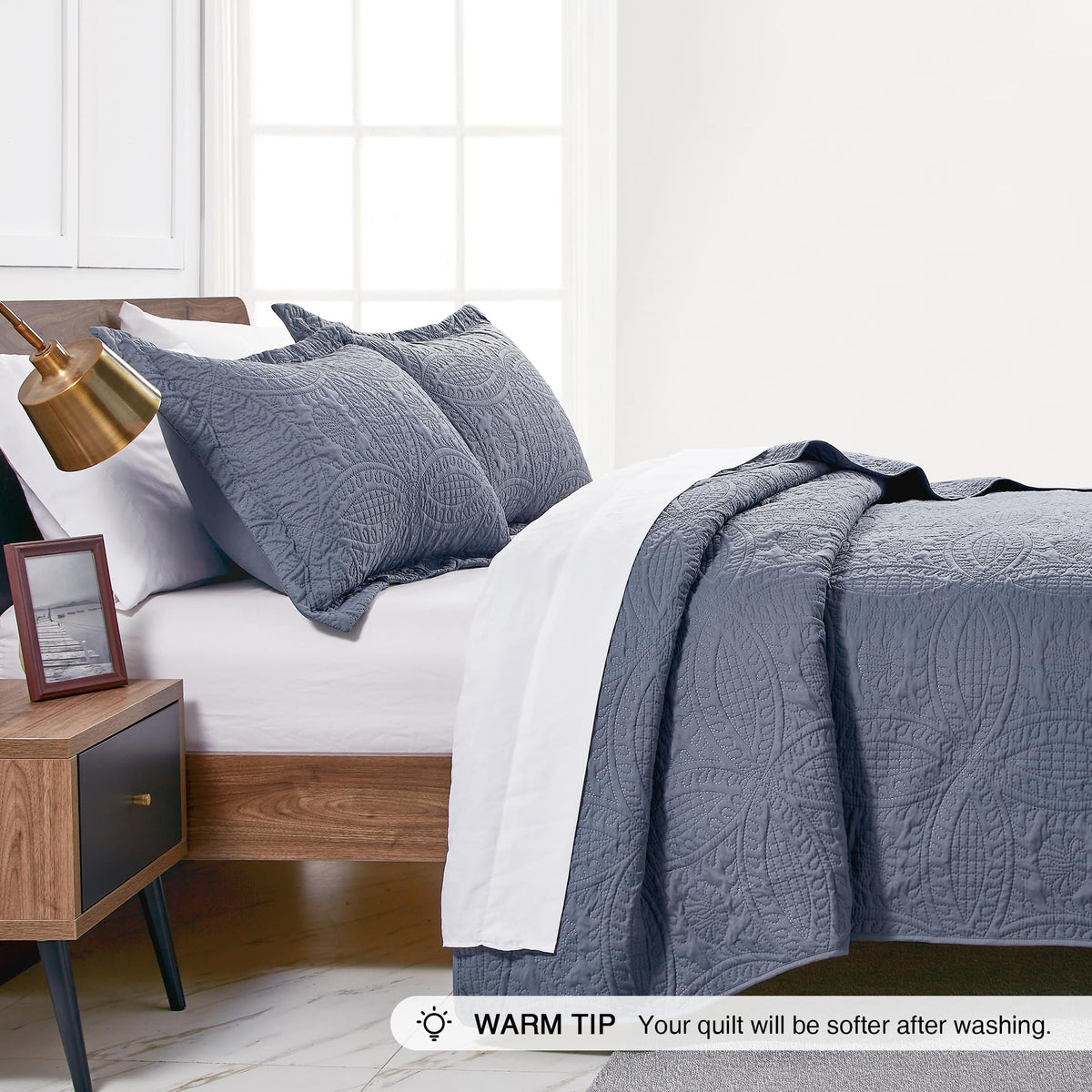 Love's cabin quilt set with two shams enhances guest room aesthetics.