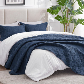Close-up of embossed wave texture in Love's cabin coverlet for durability