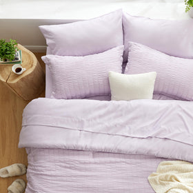 Love's cabin seersucker lavender flat sheet closeup shows soft breathable weave