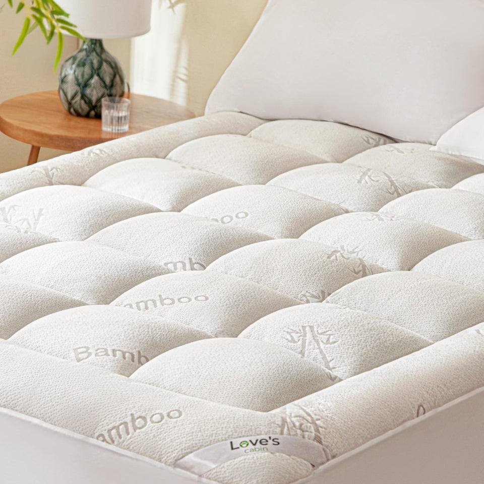 Love's Cabin twin mattress topper fabric close-up shows breathable bamboo rayon for cooler nights.