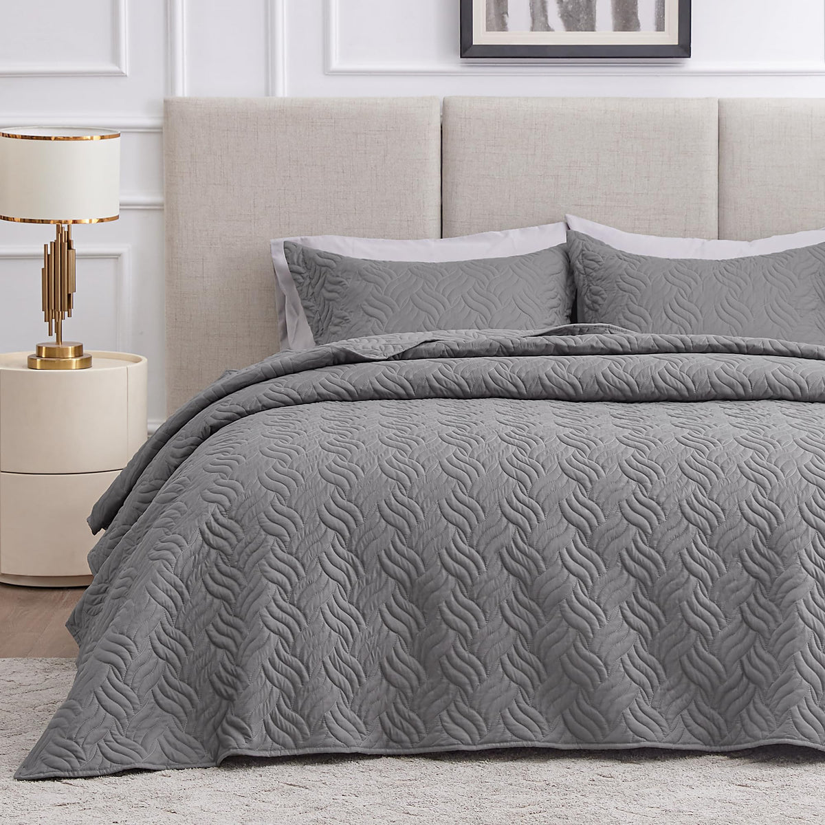 Love's cabin wave pattern quilt close-up shows embossed texture for durable, all-season comfort.
