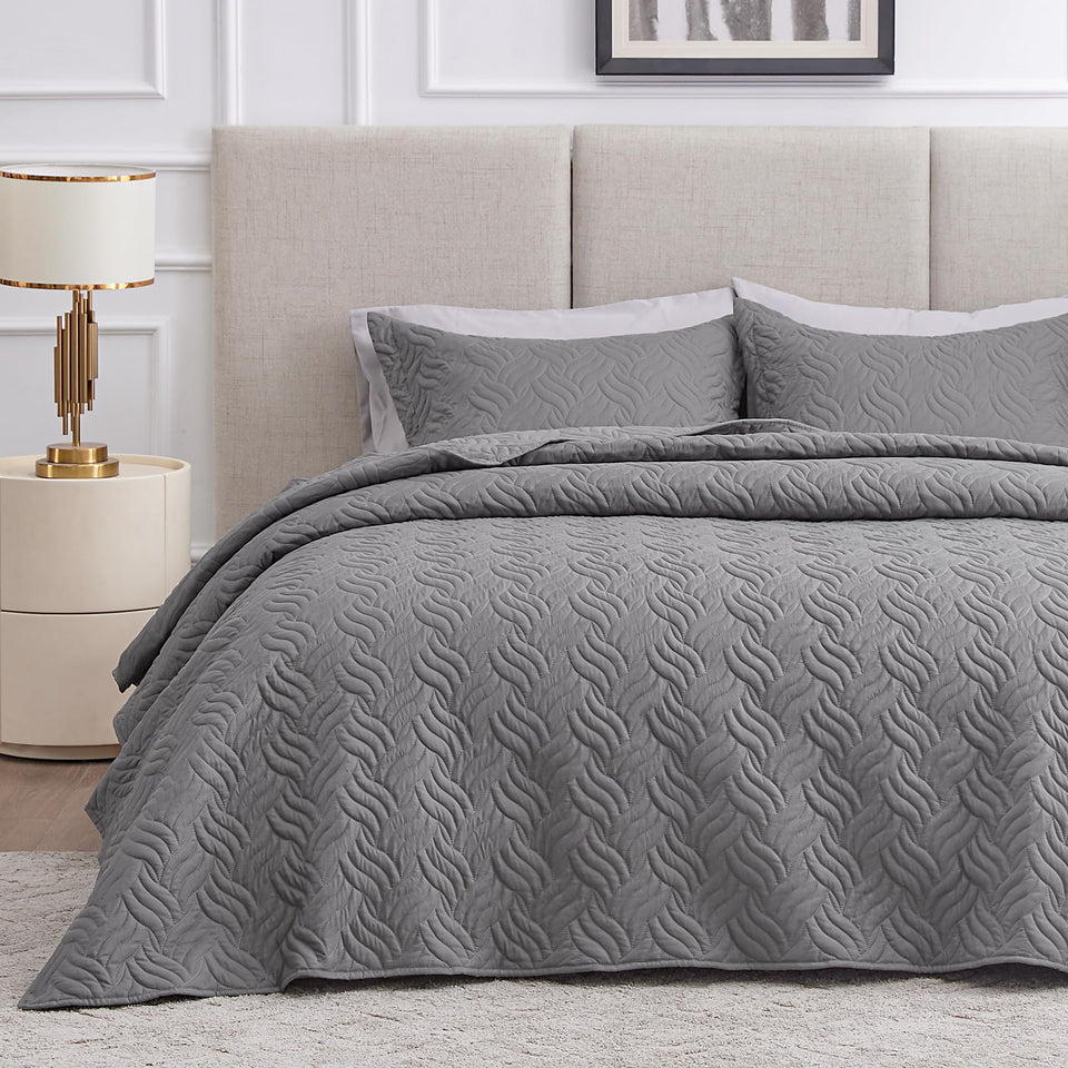 Love's cabin wave pattern quilt close-up shows embossed texture for durable, all-season comfort.