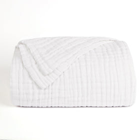 Love's Cabin white muslin blanket added as light layer on bed.