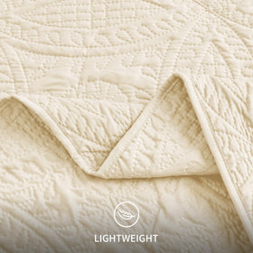 Bedroom layering idea featuring Love's cabin quilt for seasonal styling