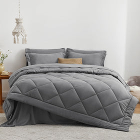 Love's Cabin grey comforter set on bed demonstrating all-season cozy styling