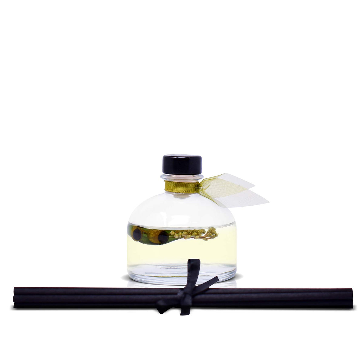 Sage-green ribbon accent on the diffuser cap.