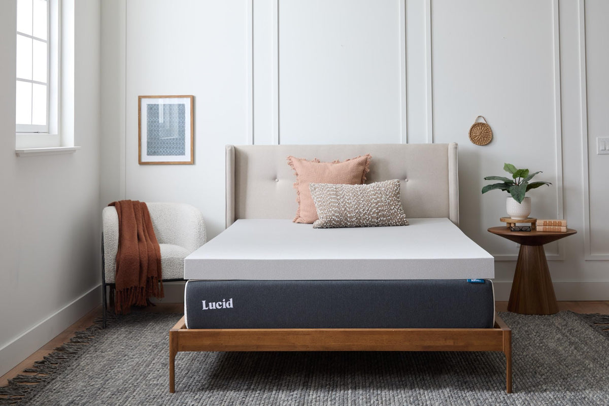 Lucid bamboo charcoal memory foam topper close-up highlights plush surface.