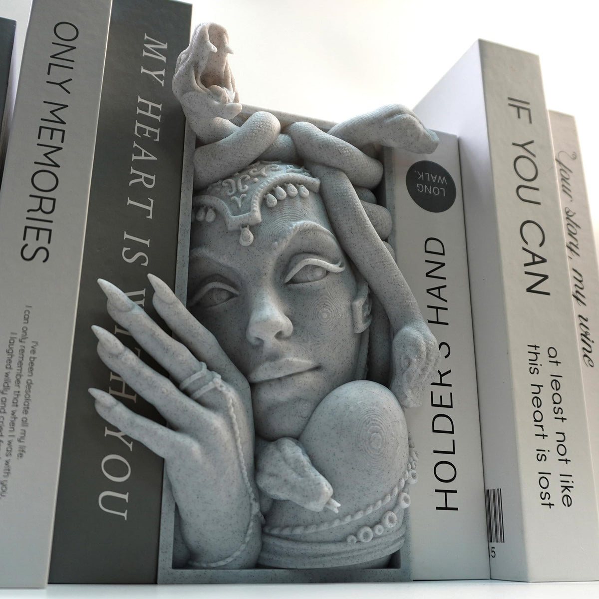 LuckyVin Medusa decorative bookend on shelf adds stylish organization.