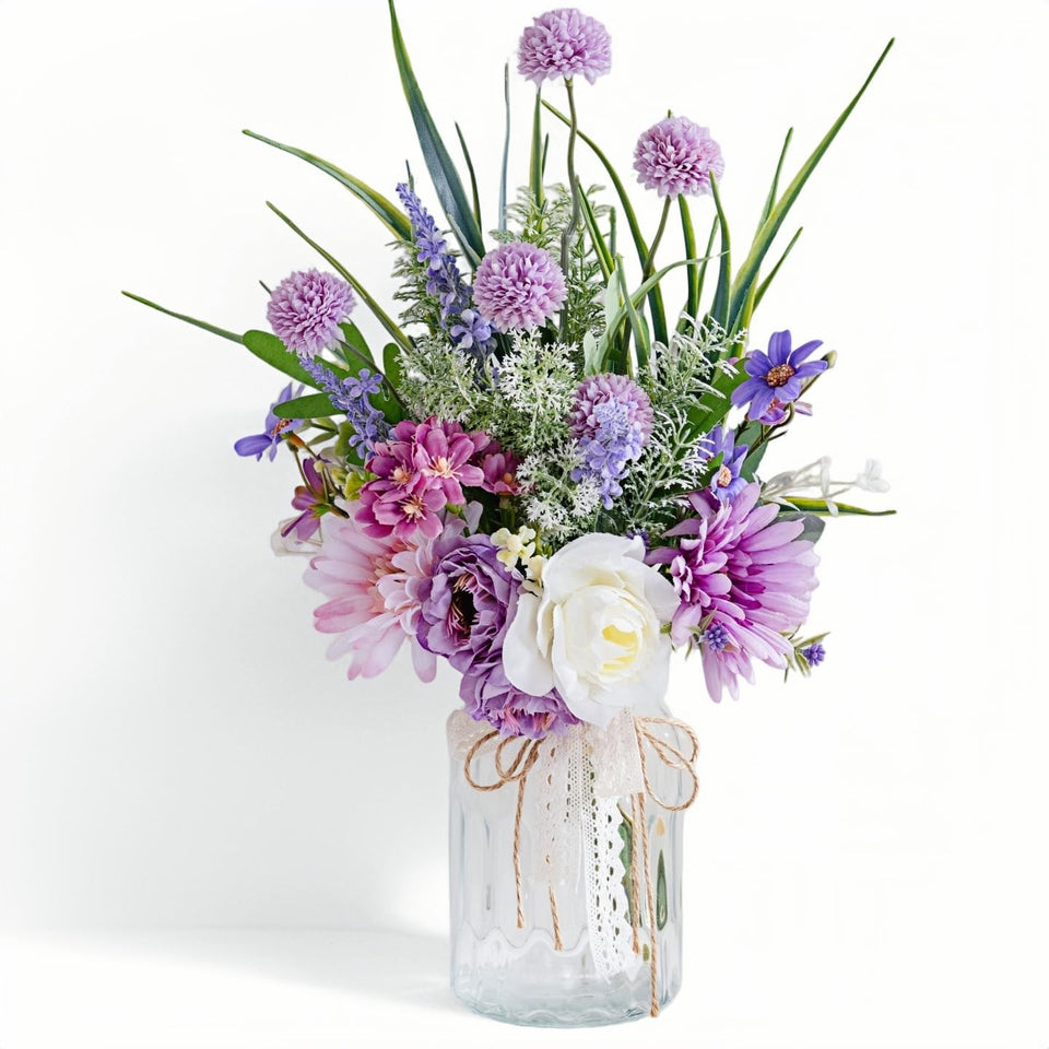 LUEUR artificial flowers in vase front view showcasing vivid Transvaal daisies for bright home decor.