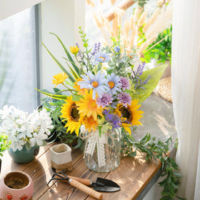 LUEUR silk daisy and sunflower arrangement adds vibrant color to spaces.