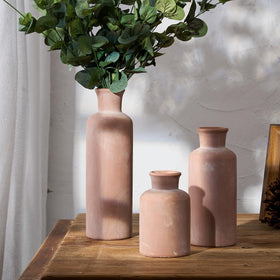 LUKA trio on a fireplace mantel adding rustic charm to the space.