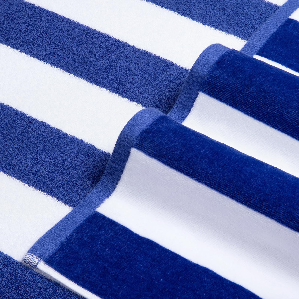 LULUHOME cabana striped towel draped on lounge by poolside