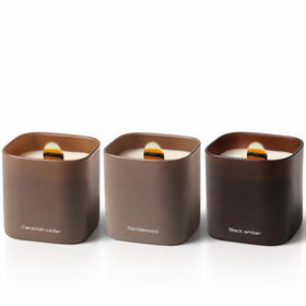 Lumi Brand Dusk to Dawn Canadian Cedar candle in a glass jar for warm, inviting evenings.