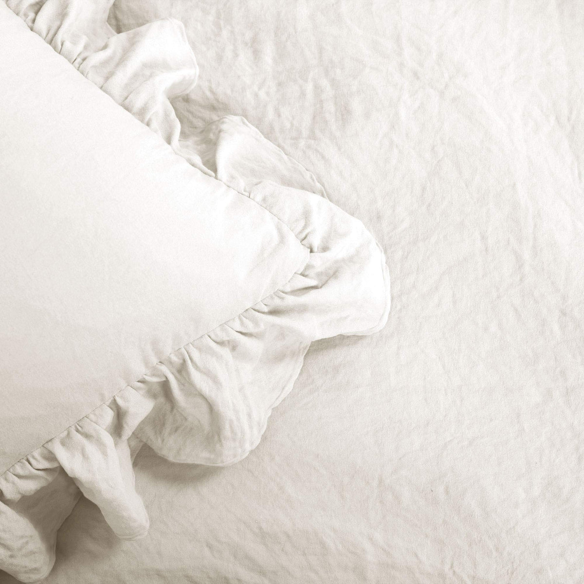 Lush Decor Reyna White bedding styled in a cozy bedroom setting