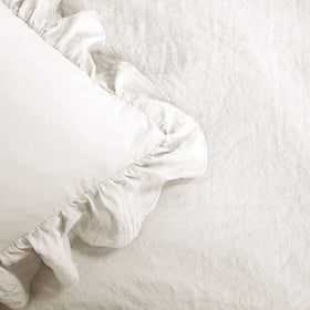 Lush Decor Reyna White bedding styled in a cozy bedroom setting